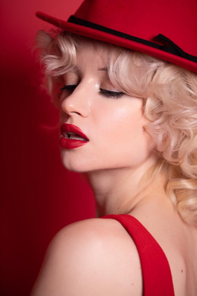 Elegant Woman in Red Fedora and Platinum Curls - Vintage Glamour Portrait