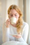 Woman Enjoying Coffee at Home – Minimal Cozy Lifestyle Portrait | Exclusive License Photo
